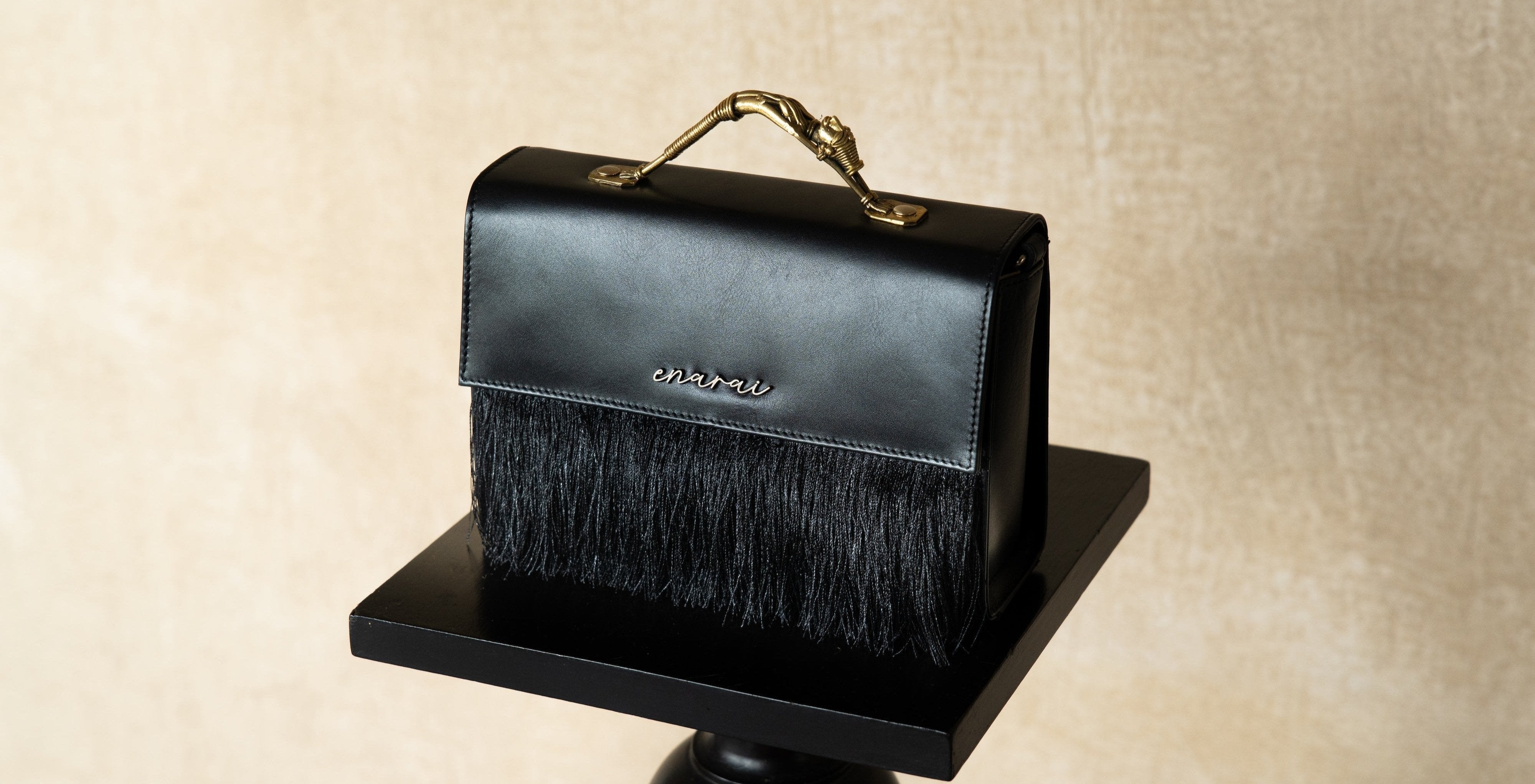 Close-up of Dokra handle on Enarai leather top handle bag